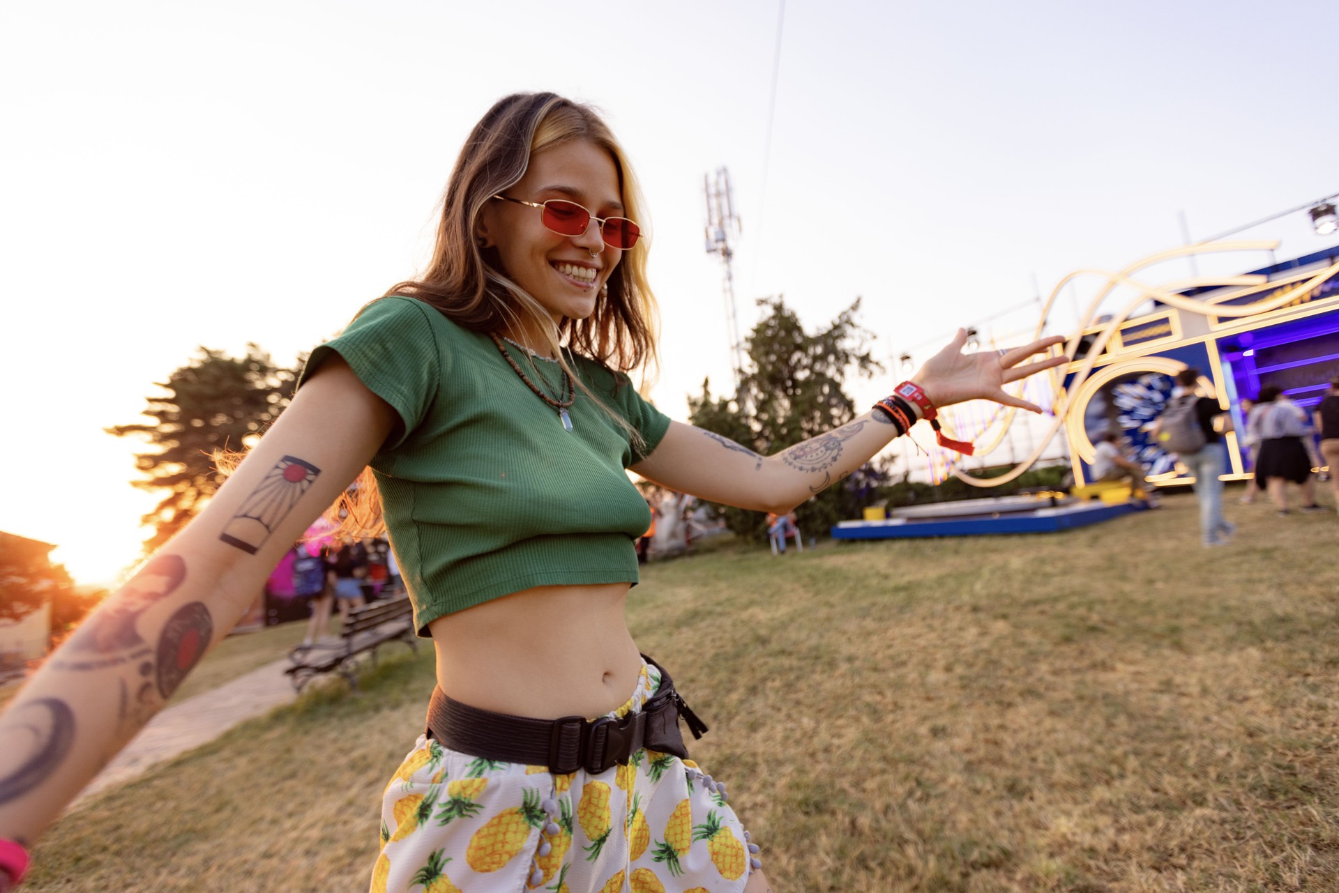 Carefree woman having fun on an outdoor music festival.